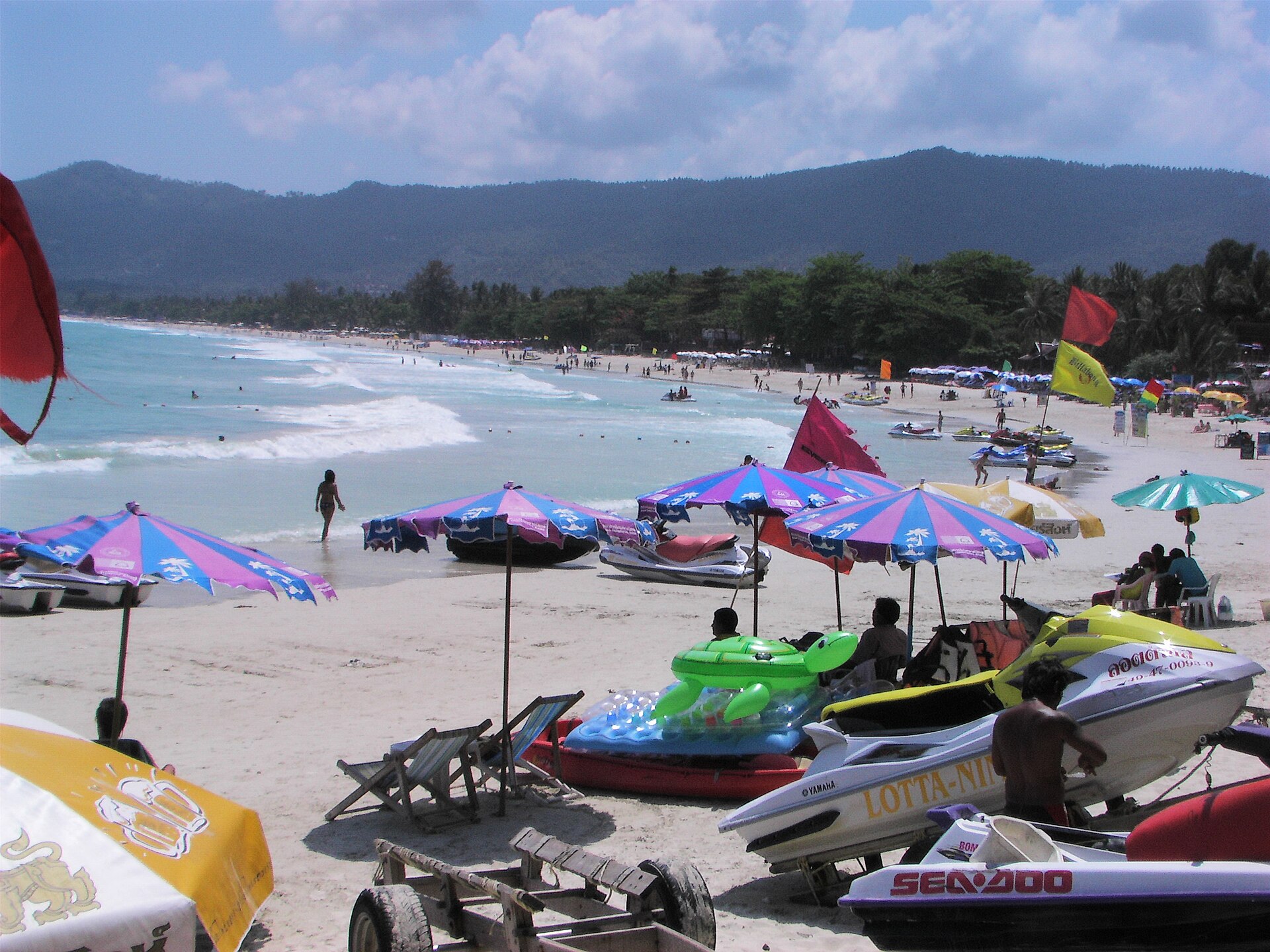 Palm trees over a white-sand beach on Koh Samui